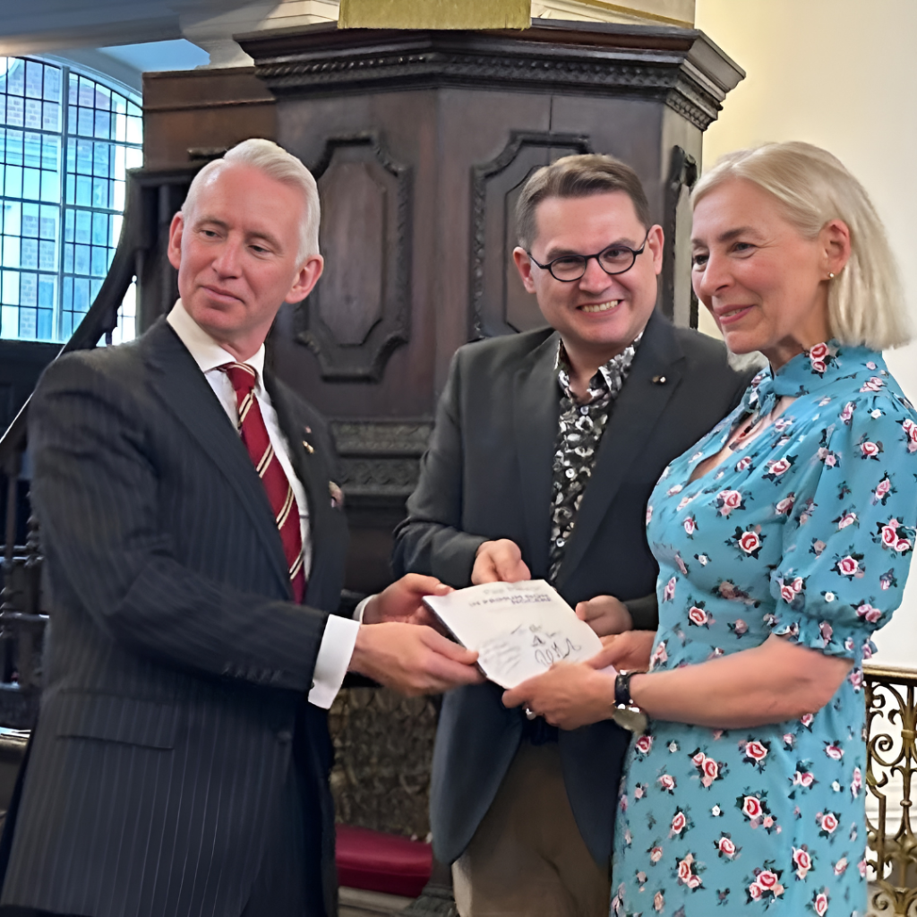 Professor Henrietta Bowden-Jones reconfirms a signed copy of the musical score of ‘In Primum Non Nocere ‘ a musical rendition of the Hippocratic Oath.